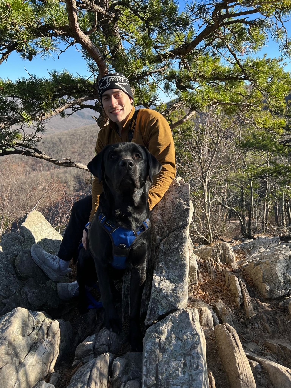 Michael hiking with his dog