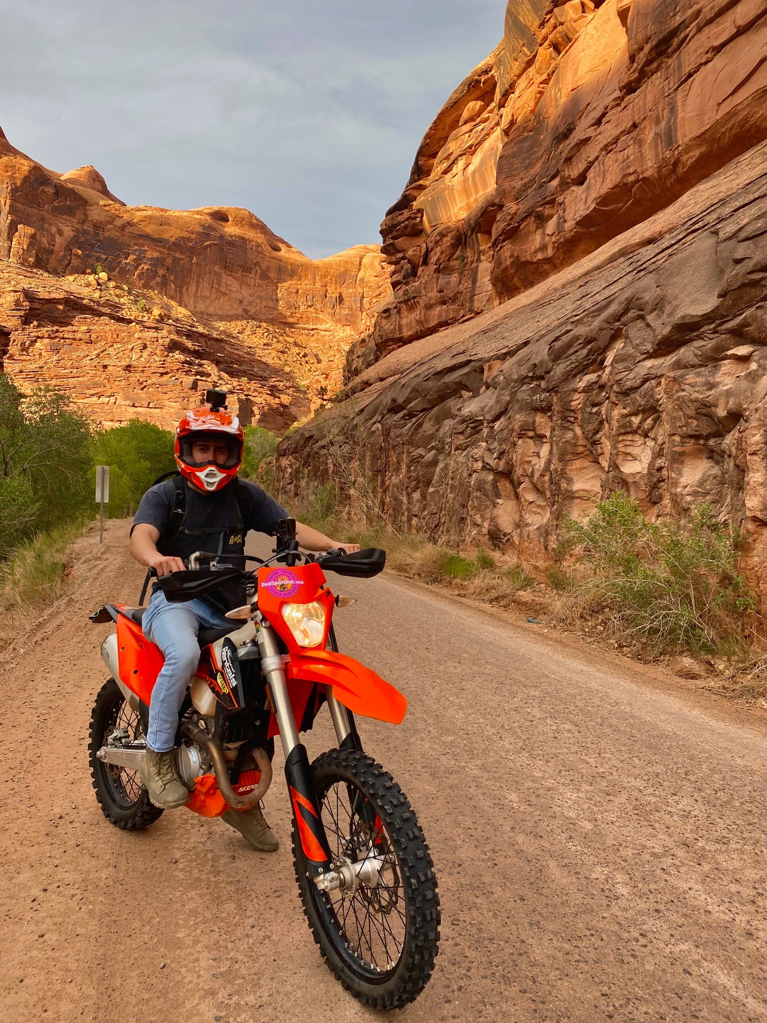 Michael riding a motorcycle through a canyon